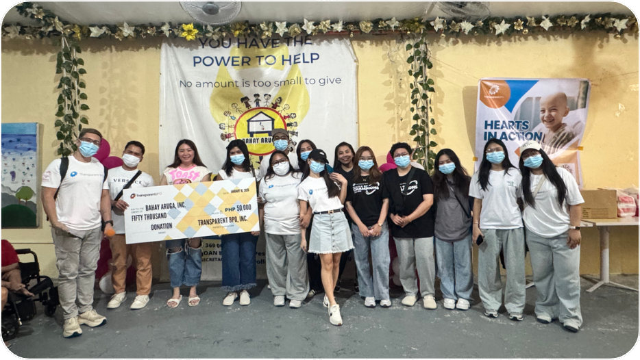Volunteers presenting a donation